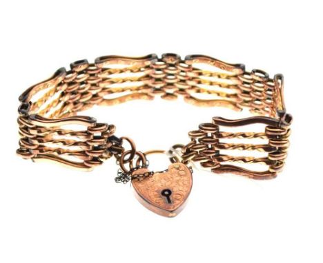  Unmarked yellow metal gate-link bracelet, with heart shaped lock stamped '9ct Gold', 17g approx