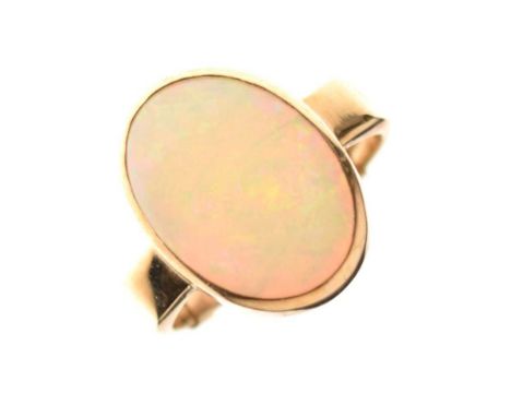 9ct gold opal set ring, size R approx, 5.2g gross approxThe oval cabochon measures 12mm x 16mm x 3mm deep approxNo obvious si