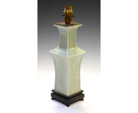 Chinese Celadon glazed porcelain table lamp of shouldered square section with relief decoration on wooden stand, 26.5cm exclu