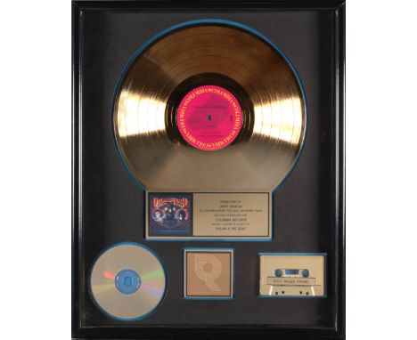A JERRY GARCIA 'GOLD' SALES AWARD FOR THE BOB DYLAN / GRATEFUL DEAD  ALBUM DYLAN &amp; THE DEAD1989presented to Jerry Garcia 