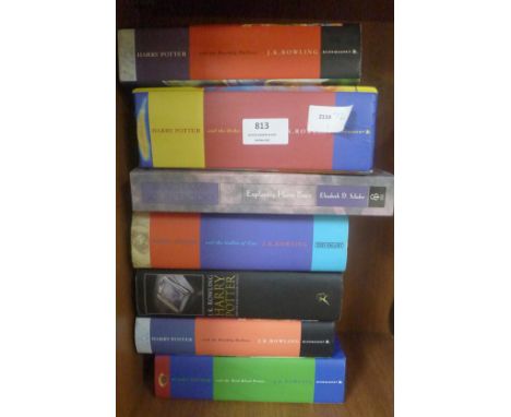 Five Harry Potter first edition hard back books including two Half Blood Prince and Deathly Hallows, an Exploring Harry Potte