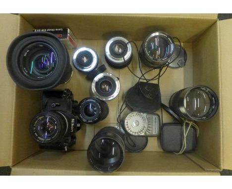 A Nikon EM SLR 35mm film camera, Nikkor telephoto lens and eight other assorted lenses and a Weston light meter 