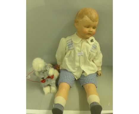 A 1920's-1930's papier mache and cloth body shop window/mannequin style walking doll, 29", dressed in period boys clothes, al