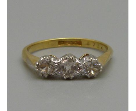 An 18ct gold, platinum and three stone old cut diamond ring, circa 1920, approximately 0.5ct diamond weight, 2.3g, K 