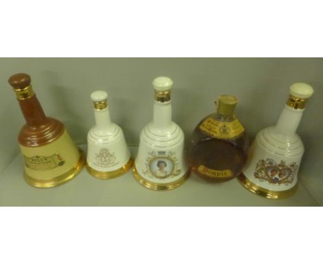 Four Bell's Scotch Whisky decanters and a Dimple bottle of whisky, all with contents 