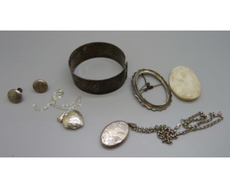A silver bangle, two silver lockets, a pair of earrings and a cameo brooch, (brooch requires repair) 