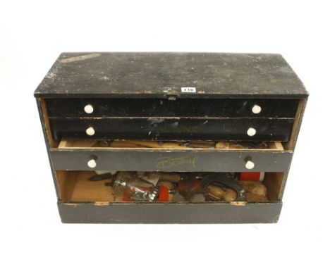 A three drawer chest with a few tools G 