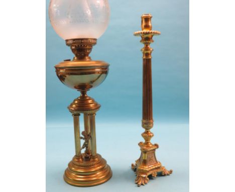 A brass lamp-stem, fluted column and triform base in continental period style, 22in., and a Victorian brass oil lamp, classic