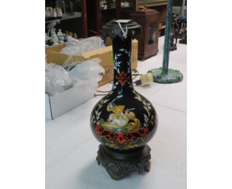 A continental ormolu-mounted porcelain lamp-stem, bulbous body painted with youths in armed combat, 16in. 