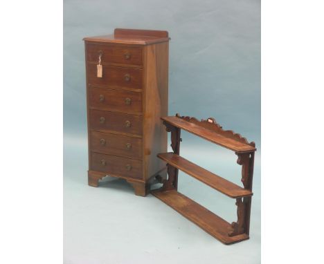 A small mahogany chest, six drawers with brass ring handles, 1ft. 4in., and a Victorian three-shelf wall unit, 2ft. 6in.