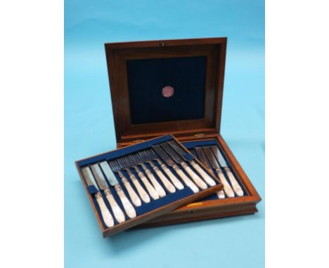 A good set of twelve Victorian silver plated dessert knives and forks, with carved mother of pearl handles, in original fitte