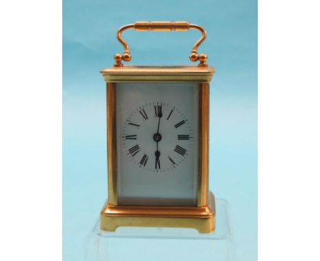 An early 20th century French gilt-brass carriage clock, enamelled dial and gong-striking movement, Obis case, 5.75in. 