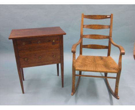 A 19th century continental beech chest, two drawers with brass ring handles, 2ft. 1in., together with a rush-seated ladder-ba