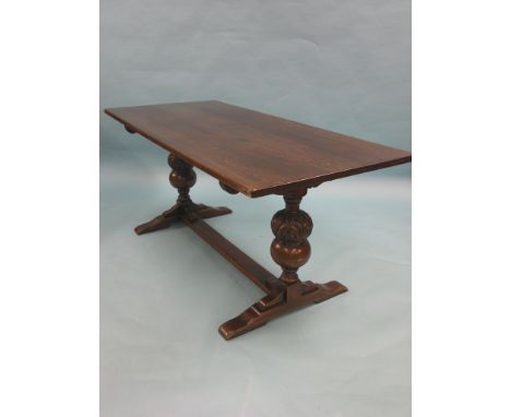 A dark oak dining table, on bulbous end supports, 5ft. 6in., two pairs of stick-back dining chairs, an oval mahogany table an