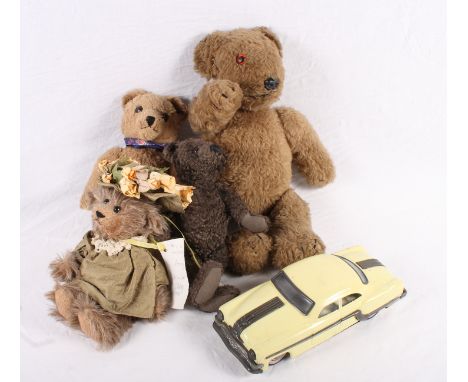 Four assorted teddy bears and a tin plate toy car