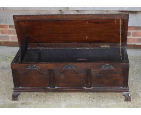 A polished as mahogany half round hall table, fitted shelf and underplatform, and a box seat footstool, upholstered in a gree