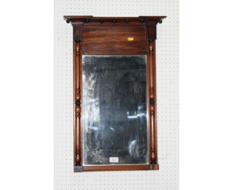 An early 19th Century mahogany wall mirror with ball decorated cornice and split turnings, plate 11 1/2" x 19"