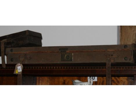 A leather shotgun case with suppliers label for G Higham Liverpool and another brown canvas gun case incorporating ammunition