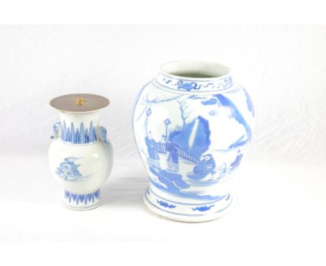 A Chinese blue and white porcelain ginger jar painted figures in a landscape, 14" high (lacking cover), and a similar porcela