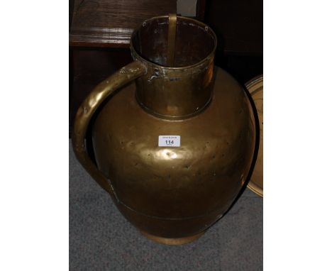 A brass water jug, five copper saucepans, in sizes, three shallow dishes, a table bell and a ladle