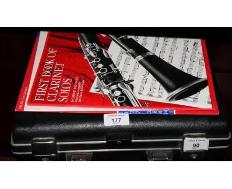 A clarinet, in case, with instruction books