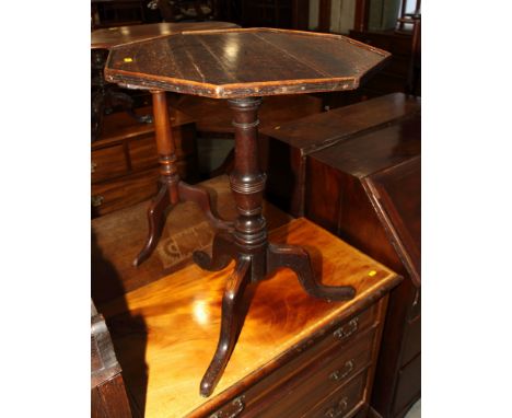 An 18th Century oak tilt top occasional table with octagonal top, on tripod base, 20" dia