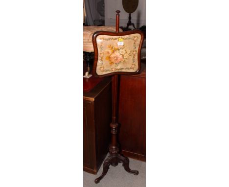 A 19th Century mahogany pole screen with square shaped floral needlework panel on carved tripod base