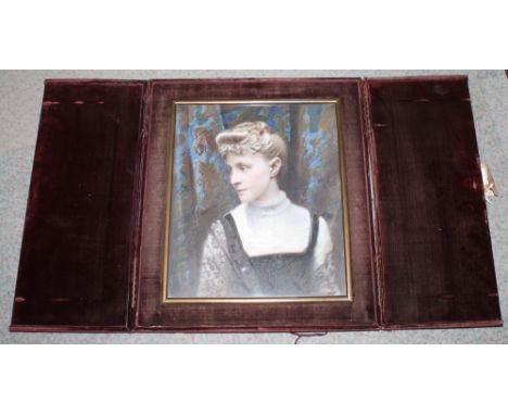 A Victorian hand-tinted glass photographic portrait of a seated lady, in velvet covered travelling case/stand, 15" x 13"