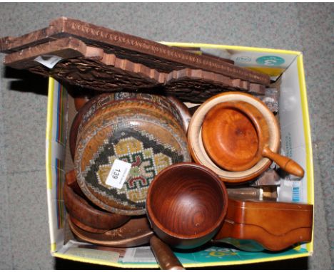 A collection of turned wooden bowls, a carved mirror with stand, a carved extending bookstand and other items of treen