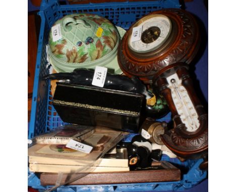 A Clarice Cliff fruit and leaf decorated butter dish and cover, a carved oak cased barometer, a Russian lacquered box, a carv