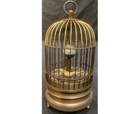 A reproduction novelty automaton clock, as a bird in a cage, 15cm high 