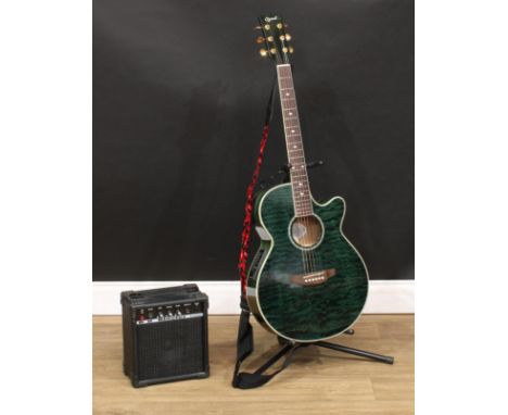 An Ozark electro-acoustic guitar, 3382G, marbled in green, mother-of-pearl inlay, soft case;  a B.B Blaster BB10 10 Watt Ampl
