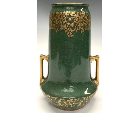 A Royal Worcester two handled vase, gilded flowers amongst scrolling foliage on mottled green ground, dated 1924, 28.5cm high