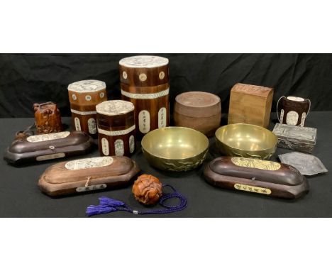 A set of three Japanese hardwood octagonal brush pot and covers, inlaid with printed resin panels, the tallest, 16.5cm; other