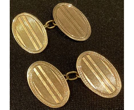 A pair of 9ct gold oval engine turned cuff links, Birmingham 1939, 4.7g 