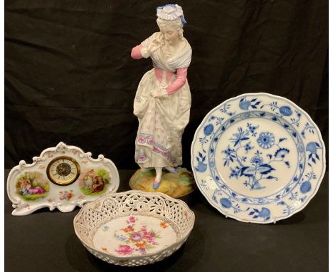 A late 19th century parian figure, elegant lady in 17th century dress, 40cm; a Meissen onion pattern shaped circular plate, 2