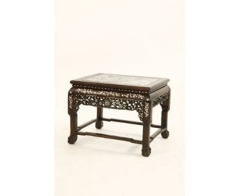 A Chinese wood vase stand,19th century, the rectangular top inset with marble, above pierced and carved apron with blossoming