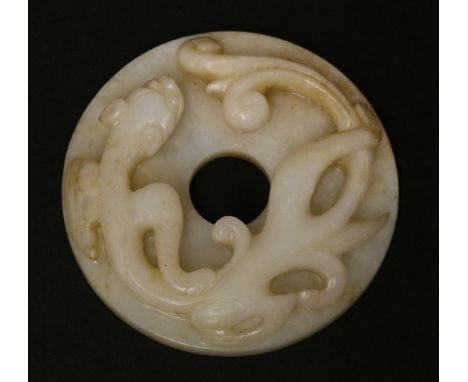 A Chinese jade bi disc,possibly Ming dynasty (1368-1644), of circular form carved with a chilong, the underside with archaic 