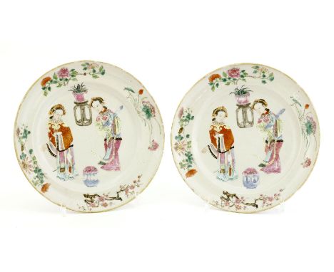 A pair of Chinese famille rose plates, Jiaqing (1796-1820), of stepped circular form, painted with two ladies, both elaborate