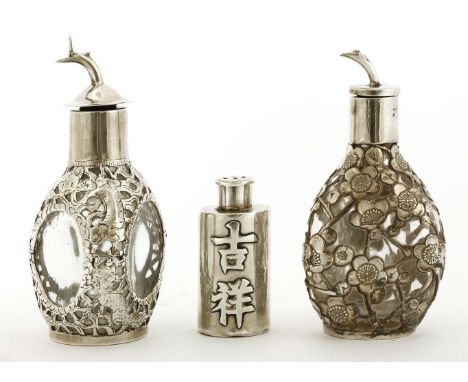 Two Chinese silver scent bottles and stoppers,c.1900, one mounted with silver decorated with dragons. stamp marked 'STERLING 