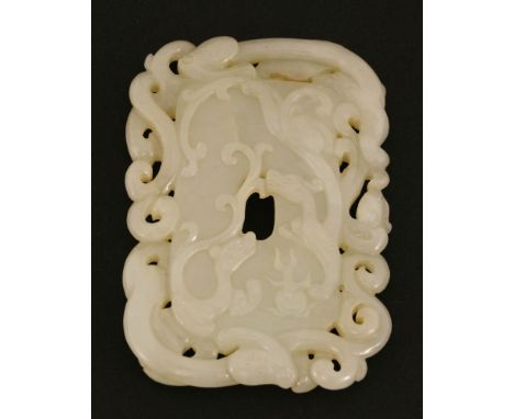 A Chinese jade disc, Qing dynasty (1644-1911), in the rectangular shape, pierced and carved with chilong chasing a flaming pe