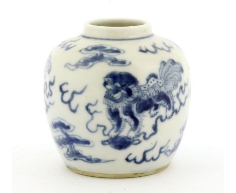 A Chinese blue and white jar, early 20th century, painted with Buddhist lions, four character Kangxi mark, 8.5cm high