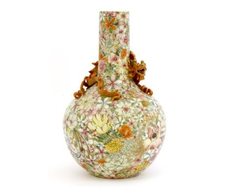 A Chinese famille rose vase,early 20th century, the shoulder with an applied dragon chasing a flaming pearl, on a millefleurs