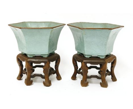 A pair of Chinese planters,20th century, each of hexagonal shape on bracket feet, covered in duck-egg blue,20.5cm wide, wood 