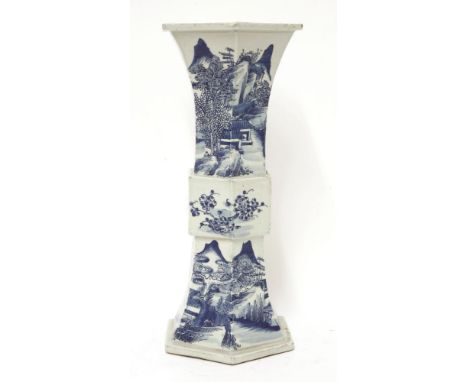 A Chinese blue and white gu vase,19th century, of hexagonal form, painted with a mountainous landscape, four character Kangxi