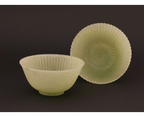 A pair of Chinese pale celadon jade chrysanthemum 'Lindsay' bowls, Jiaqing (1796-1820), each with thin rounded sides carved a