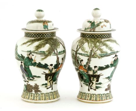 A pair of Chinese famille verte jars and covers,early 20th century, painted with an official stopping a lady seated on a donk