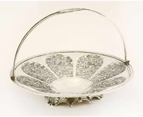 A Chinese silver cake basket, c.1890, by Wang Hing, of circular form with pierced panels of dragons amongst clouds, the swing