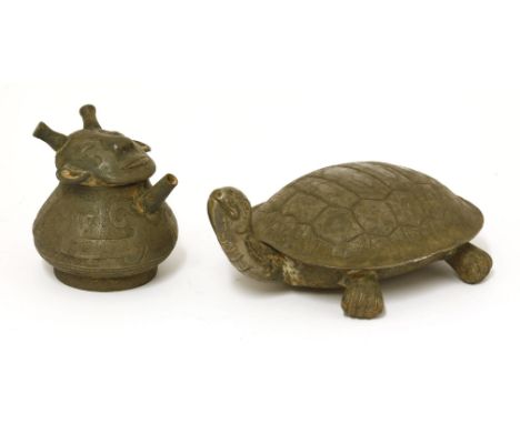 A Chinese silver box and cover,in the shape of a turtle stretching its neck,21cm long, anda silver ewer,engraved with archaic