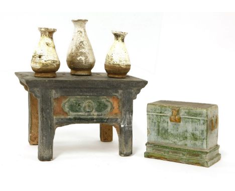 Two Chinese models of furniture,Ming dynasty (1368-1644), comprising:a Chinese green-glazed desk, with moulded bracket apron 